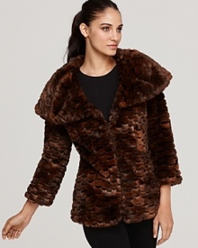 This plush GUESS faux fur coat showcases one of this season's most touchable textures, and finishes the statement with a wide portrait collar and chic cropped sleeves.