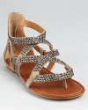 Rocker meets bohemian on these STEVEN BY STEVE MADDEN sandals, boasting soft suede toughened up by gunmetal rhinetones.