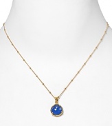 This haute bohemian pendant necklace from Coralia Leets charms with rich texture and hue. The gleaming gold setting sets off a blue chalcedony stone.