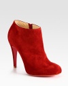 Lifted by a self-covered heel, soft suede shapes a sophisticated, side-zip ankle boot. Self-covered heel, 4 (100mm)Suede upperSide zipperLeather liningSignature red leather solePadded insoleMade in ItalyOUR FIT MODEL RECOMMENDS ordering true size. 