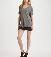 Comfy, silk-blend style with dropped shoulders and a rounded v-neck. Rounded v-neck Short sleeves Dropped shoulders Longer length hits below the hips 67% rayon/33% silk Hand wash Imported