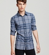 Soft blue hues make a subtle statement on the check-printed Burberry Treyforth shirt.