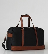 Ecoalf's leather-trimmed overnight bag brings crisp lines and modern design to your weekend away.