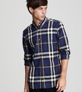 Burberry's essential button-down rendered in a rich check pattern and slim fit.