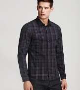 This cotton button down has a crumpled texture allover, a modern fit and Burberry's signature check pattern allover.