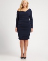 Divine matte jersey, tantalizingly fashioned with one sexy bare shoulder and graceful ruching, front and back.Asymmetrical V neckline with flanged trim, front and backOne bare shoulderLong sleevesRuched bodice and skirtFitted shapingAbout 24 from natural waistRayon/spandexDry cleanMade in USA