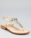 Dazzling crystals rest atop shimmering metallic leather on a sleek and simple sandal silhouette. From IVANKA TRUMP.