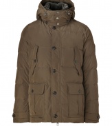 Stylish and sporty with an ultra soft fur trimmed collar, Woolrichs Pocono down parka is a must for cool weather looks - Stand-up collar with fur trim, hooded, long sleeves with tabbed cuffs, hidden two-way front zip, button panel, buttoned front patch pockets, quilted - Contemporary fit - A versatile, classic coat perfect for both city streets and country slopes