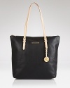 This go-to tote from MICHAEL Michael Kors gets you through your commute with effortless elegance and easy glamour.