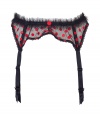 Get the sultry glamorous look of a vintage 1950s pin up girl in Von Follies by Dita Von Teeses black mesh suspender belt, detailed with ruffled trim and fun red embroidered dots - perfect for giving as a saucy holiday gift! - Embroidered red dots on front, sheer black ruffled mesh trim, dotted mesh back, scalloped lace trim, adjustable back hook-and-eye closures, satin garter straps with clips - Wear with the matching balconette bra and silk stockings for a seriously seductive look