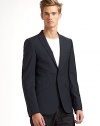 THE LOOKPeaked lapel with button opening One-button front Long sleeves with four button cuffs Single welt pocket at chest Three flap pockets at front Single vent at backTHE MATERIALVirgin wool Cupro liningCARE & ORIGINDry clean Imported