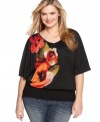 An embellished floral print rejuvenates Style&co.'s short sleeve plus size top, finished by a smocked hem.