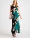 A brilliant floral print in muted hues gives this maxi dress with a waist-defining, self-tie belt a simply elegant look. You will certainly turn heads in this ultra-flattering design.Round necklineSleevelessSelf-tie beltButton closure at keyhole backAbout 43 from natural waist95% polyester/5% elastaneMachine washImported