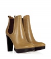 This must-have ankle boot is a versatile new season must-have - Pointed toe, front platform, ankle length, elasticized side panels, chunky high heel, back pull-on tab - Wear with skinny jeans, a mini skirt, or cropped trousers