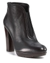 Poised elastic panels center these sleek platform booties for style equilibrium day or night. By Stuart Weitzman.