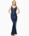 Exuding bold, elegant appeal, this floor-length dress is tailored with a sequined mesh overlay and finished with a sexy V-neckline at the front and back for a sleek, feminine look.