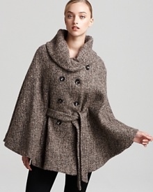 Ever-so chic, this Calvin Klein cape is rendered in a classic tweed for the epitome of city style. The effortless finishing touch to your day-to-night look, it will take you from fall into winter with sophisticated luxury.