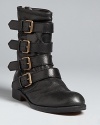 Buckle up-and up, and up-MARC BY MARC JACOBS takes moto style at a faster pace in these strap-happy boots.