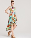 A bold artsy print and dramatic high/low hem make this ALTERNATIVE dress a statement-making stunner.