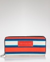 Practical accessories have a place in every it-girl's purse. But in vivid stripes, this croc-embossed rubber from MARC BY MARC JACOBS is almost too chic to keep inside.