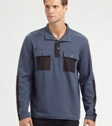 Fleece pullover with modern inspirations, accented with nylon contrasting trim and double-chest pockets for a handsome finish.Button-front95% cotton/5% lycraMachine washImported