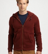 A casual-wear staple is deep dyed to a cool brick hue for instant everyday style.Two-way zip frontAttached drawstring hoodFront kangaroo pocketsCottonMachine washImportedOUR FIT MODEL RECOMMENDS ordering true size. 