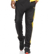 On the run. Keep yourself moving at a steady pace with these active pants from the Puma Usain Bolt collection.