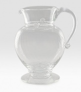 A simply stunning glass pitcher marries a traditional silhouette with a spiraled sphere ground. Extraordinary thread and berry detail creates all the interest and charm of an heirloom classic. 76 oz. capacity 9½H X 7½ diam. Dishwasher safe Imported 