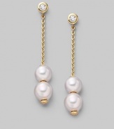 From the Pearls in Motion Collection. Delicate chains of 18k gold dangle from diamond studs and hold white Akoya pearls that slide up and down but stay where you place them. 7mm white round cultured pearls Quality: A+ Diamonds, 0.14 tcw 18k yellow gold Drop, about 1¾ Post back Imported