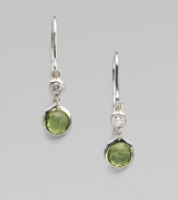 From the Silver Rain Collection. A lovely peridot, richly faceted in a modern sterling silver setting, is capped by one shimmering diamond.Diamonds, .07 tcw PeridotSterling silverDrop, about 1Ear wireImported