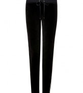 Work a modern edge into your laid-back look with Juicy Coutures jet black skinny velour pants - Drawstring elasticized waistline, tan grosgrain trim - Slim leg, figure-hugging fit - Team with oversized pullovers and chic fashion sneakers