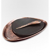 A smooth, rounded pebble shape with the distinctive beauty of bronze-finish alloy and wood creates the ultimate hostess or wedding gift. From the Heritage Pebble CollectionIncludes cheese knifeAntique copper-plated alloy15W x 11LHand washImported