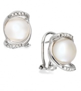 Capturing elegance. This sterling silver pair of stud earrings, with cultured freshwater button pearls (9-10 mm) and diamonds (1/10 ct. t.w.) embodies grace and style. Approximate length: 2-3/4 inches. Approximate width: 3/4 inch.