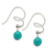 Fun style with colorful flair. Jody Coyote's unique swirl drop earrings are crafted in sterling silver with a colorful turquoise bead (6 mm). Approximate drop: 1 inch.