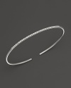 A simply modern diamond bangle in 14K white gold from Meira T.