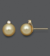 Embrace timeless beauty with simple studs. These south sea pearls (8-9 mm) boast a rich, golden color with round-cut diamond (1 ct. t.w.) for an extra hint of sparkle. Earrings crafted in 14k gold. Approximate diameter: 1/3 inch.