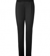 Jil Sanders black virgin wool pants are an artfully crafted example of elegant, precision tailoring - Medium-rise, slim cut style with a touch of stretch - Banded waist and side zip - Crease detail flatters and elongates the leg - Pant tapers and crops at ankles with a sleek vent - Polished and effortlessly chic, perfect for pairing with button downs or pullovers and ballet flats or pumps