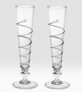 Hand-placed threading winds around a pair of beautiful, mouthblown Champagne flutes in single spirals to create a look that's both traditional and contemporary. Boxed set of 2 9 high Dishwasher safe Imported