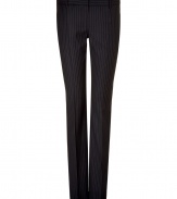 Stylish pant in fine, pure wool - Classically elegant in navy with subtle pin stripe - Modern silhouette is long and slim - Pleat detail at front and back extends from hip to hem, lengthening and flattering the leg - Tab closure and belt loops - Welt pockets at rear - A sleek, sophisticated go-to for day and evening - Pair with a silk or sequin blouse, a blazer and platform pumps