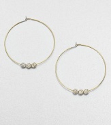 From the Brilliance Collection. A slender wire hoop, adorned with three sparkling beads, creates a look of understated glamour.GlassGoldtoneDiameter, about 1.25PiercedImported