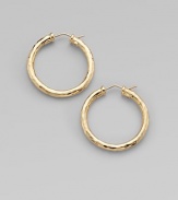 From the Martellato Collection. Graceful hoops with a rich hammered texture in gleaming 18k gold.18k yellow goldDiameter, about 1¼PiercedMade in Italy