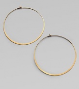 Make a quiet statement in these elegant hoop earrings. Goldtone metalLength, about 2.25Post closureImported 