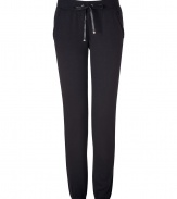 Perfect for pairing with sky-high heels, Juicy Coutures ultra comfy cuffed pants lends an edge of effortless feminine attitude to your outfit - Flat drawstring tie with gold-toned aglets, terry trimmed side slit pockets, fitted cuffs, sweatpant-style - Loosely fitted - Wear with a tee, boyfriend blazer and pumps