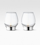 A masterful balance between strength and poetry, handcrafted in glass with a bulb-like shape that disperses soft candlelight. From the Grace CollectionSet of 2 Glass with stainless steel base3¼H X 3 diam.Hand washImported