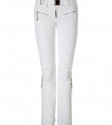 Make a chic statement on the slopes in Jet Sets ultra modern stretch ski pants, finished with a flattering cut guaranteed to show off your sporty side in style - Zip fly, zippered front pockets, adjustable belt in front, straight leg with silver star circle print, flared zippered ankles, partially lined legs from the hemline to thigh, elasticized band at the thigh with silicon for hold - Fitted through the knee - Wear with figure-hugging turtlenecks and cozy shearling lined boots