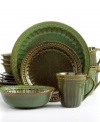 Go green. Add a touch of tradition to your table with this distinctive dinnerware set from Gibson. Fluted details meld with a mottled hue, imbuing any occasion with old-world charm.