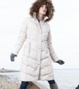 Calvin Klein's knee-length puffer coat features a down-blend fill for heavyweight warmth, while a faux-fur-trimmed hood adds a luxe touch.