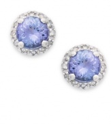 True beauties. These stunning earrings feature round-cut tanzanite (9/10 ct. t.w.) surrounded by halos of round-cut diamonds (1/8 ct. t.w.). Set in sterling silver. Approximate diameter: 7-1/2 mm.