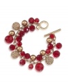 Festive and fashionable. Chic crimson-colored glass beads are enhanced by gold glass pearls and glittering charm embellishments on this striking cluster bracelet from Carolee. Crafted in gold tone mixed metal with a toggle closure. Approximate length: 8 inches.