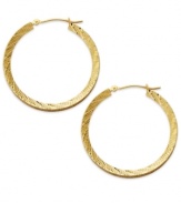 Lovely and luxe, these 14k gold wheat hoops complement any look. Each diamond-cut earring secures with a lever backing. Approximate diameter: 1-1/4 inches.